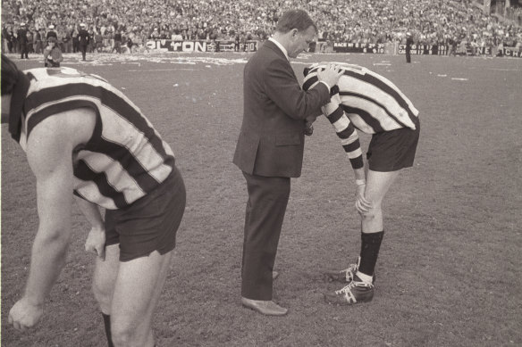 Collingwood coach Bob Rose consoles Ross 'Twiggy' Dunne after the devastating loss.

Collection: AJB