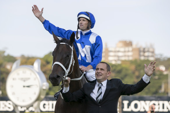 Jockey Hugh Bowman and trainer Chris Waller celebrate Winx’s Queen Elizabeth Stakes win in her final race in April 2019.