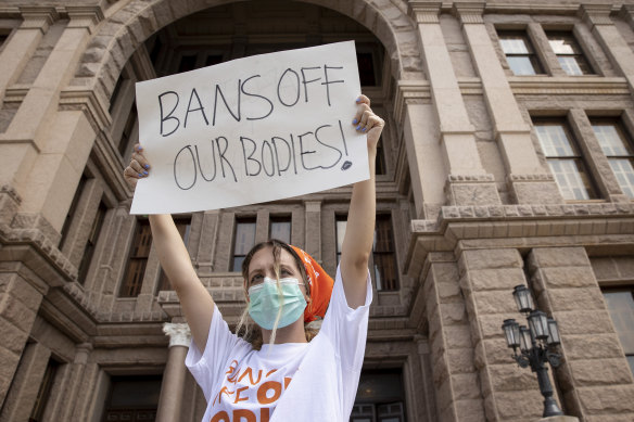 A woman participates in a protest against the six-week abortion ban in Texas.