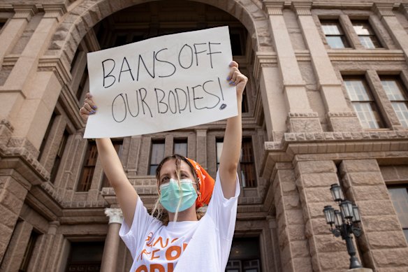 A woman participates in a protest against the six-week abortion ban in Texas.