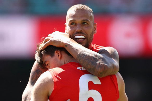 Logan McDonald celebrates kicking a goal with Lance Franklin.