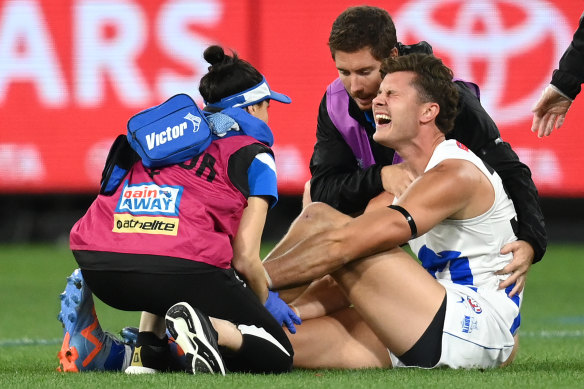 Charlie Comben in pain after sustaining the injury against Melbourne on Saturday.
