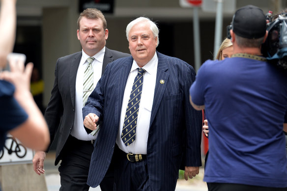 Clive Palmer, centre, has made several claims about vaccines in an interview on ABC radio.