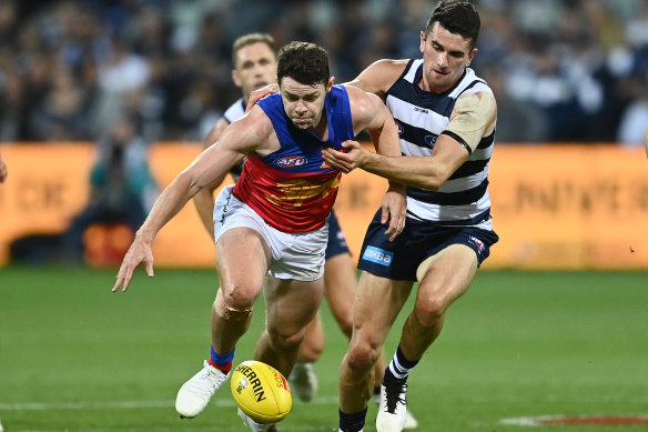 Geelong’s Mark O’Connor comes to grips with Brownlow medallist Lachie Neale.