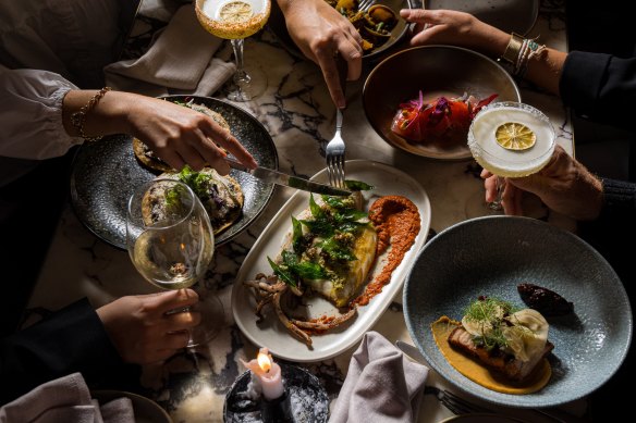 A parilla grill and vertical rotisserie fire the menu at Esteban.
