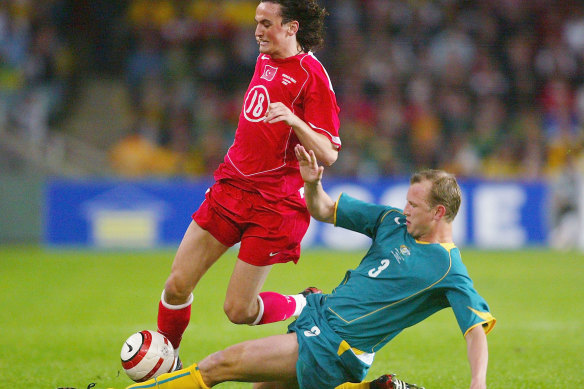 Laybutt (right) in action for the Socceroos against Turkey in 2004.