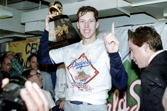 Orel Hershiser celebrates the 1988 World Series win with his MVP trophy.