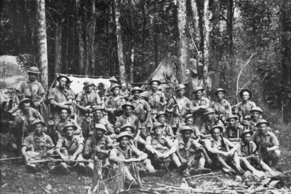 A group portrait of 9 Platoon, A Company, 2/14th Infantry Battalion on the Kokoda Trail. Harry Saunders is the  fourth from right in the front row.