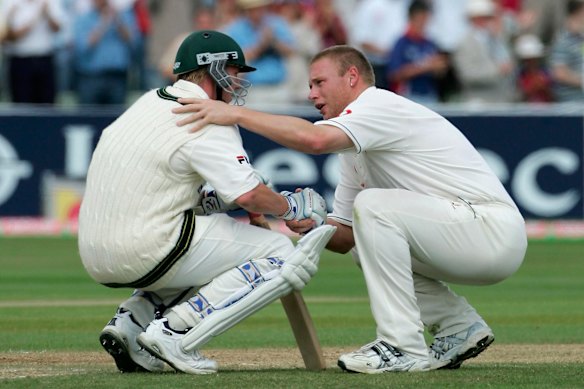 Andrew Flintoff of England consoles Brett Lee of Australia after England defeated Australia on day four of the second Ashes Test in 2005. 
