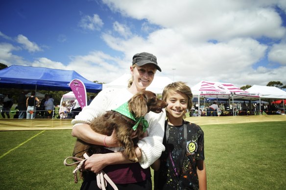 Champion hound Frankie with owners Susan Fernando and Ollie.