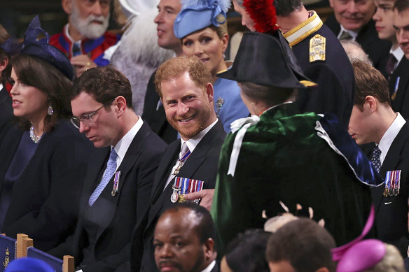 Prince Harry speaks to Anne, the Princess Royal in Westminster Abbey, ahead of the coronation.