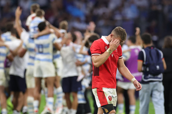 Dan Biggar of Wales looks dejected as he walks off the pitch.
