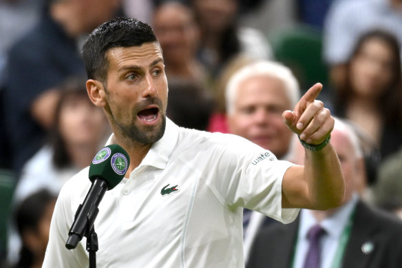 Novak Djokovic addresses the crowd on centre court after his victory over Holger Rune.