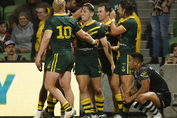 Teammates congratulate Cameron Murray for scoring in a sixth consecutive Test.