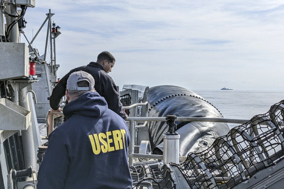 FBI agents prepare to recover balloon material on the ocean floor off the coast of Myrtle Beach, South Carolina. 

