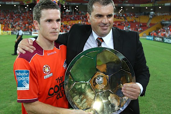 Ange Postecoglou and Brisbane Roar captain Matt McKay with the A-League premiership in 2011.