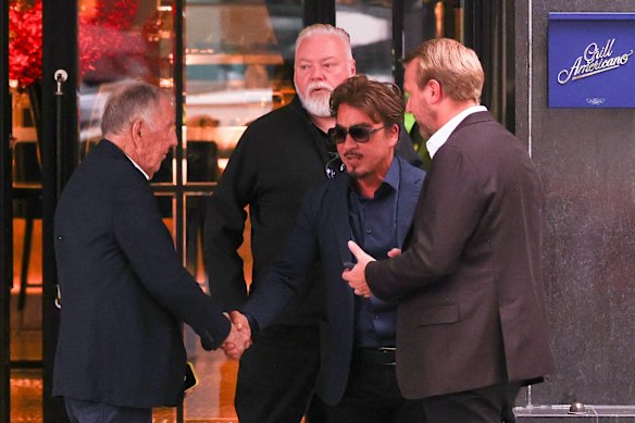 Kyle Sandilands was spotted dining with John Singleton and John Ibrahim days after settling his court case with ARN.