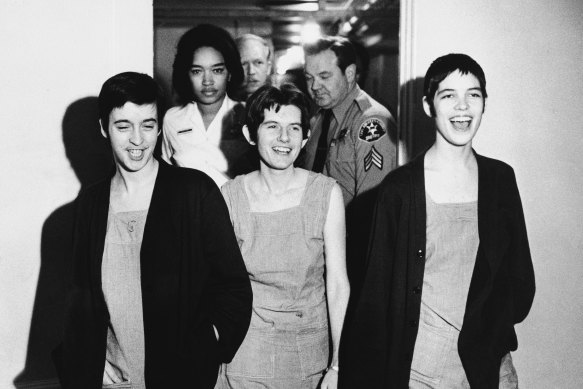 Three women co-defendants in the Sharon Tate murder case, from left, Susan Atkins, Patricia Krenwinkel and Leslie Van Houten, laugh as they walk to court in Los Angeles for sentencing on March 29, 1971. 