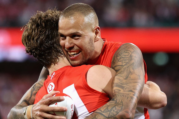 Lance Franklin and Dane Rampe celebrate after beating Collingwood by a point in Saturday night’s preliminary final.
