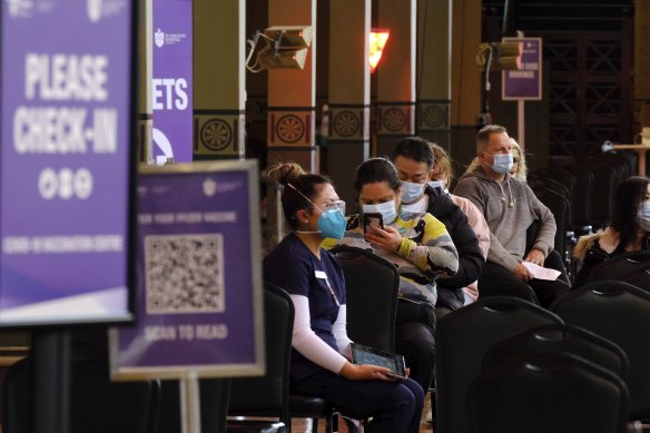 Patients wait in line for the vaccine.