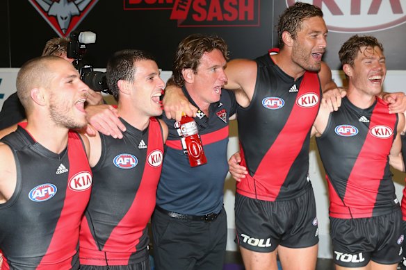 Good times: James Hird as Essendon coach in 2015 celebrates a win with his players.