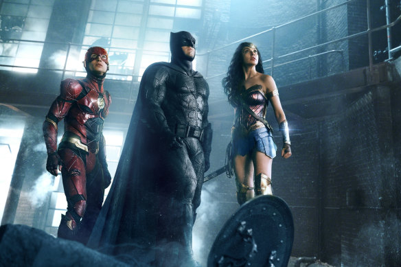 The Flash (Ezra Miller), Batman (Ben Affleck) and Wonder Woman (Gal Gadot) in a scene from Zack Snyder’s Justice League.