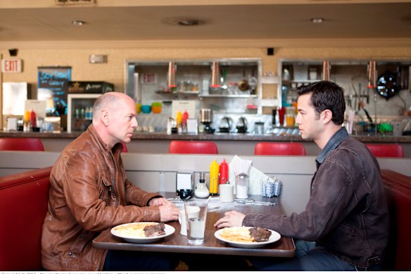 Bruce Willis and Joseph Gordon-Levitt in Looper.