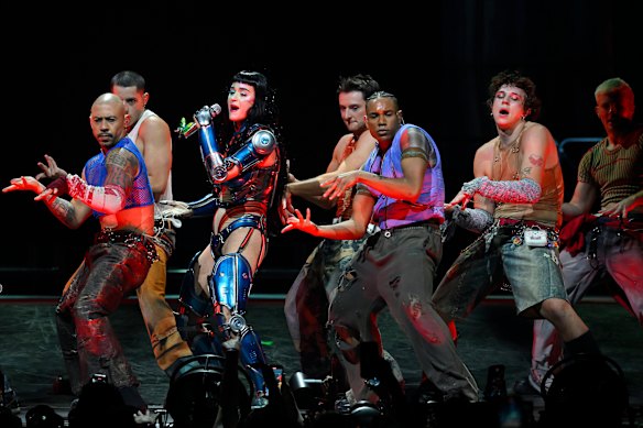 Perry and her team of 10 dancers work their collective butts off.