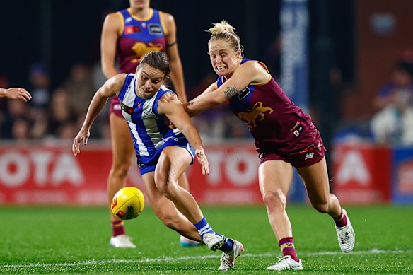 Ash Riddell and Isabel Dawes compete for possession.