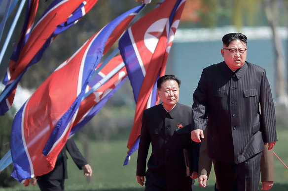 Choe Ryong-hae, vice-chairman of the central committee of the Workers' Party and No. 2, walks up a ramp behind Kim Jong-un in 2017. His son is believed to be married to Kim's sister Yo-jong.