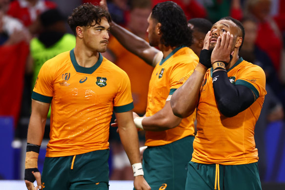 Dejection: Wallabies players after the record defeat to Wales.