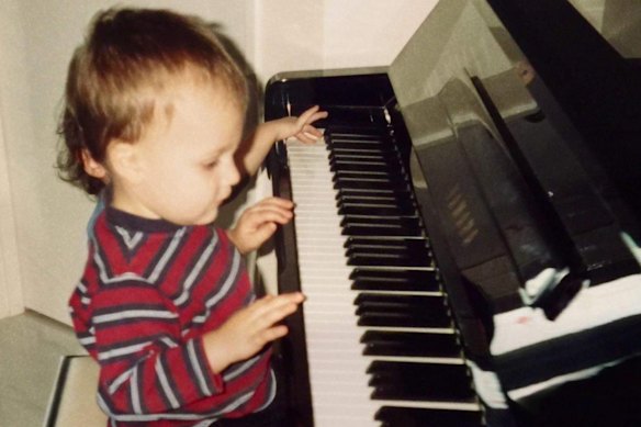 Ethan French on the piano as a child. His talents are now being enjoyed by a global audience.