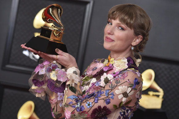 Swift with her award for Album of the Year for Folklore at the 63rd annual Grammy Awards in Los Angeles on March 14. 