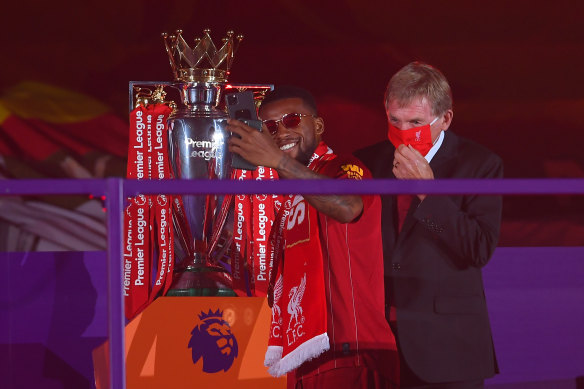 Liverpool's Georginio Wijnaldum takes a  selfie with the Premier League trophy, awarded to Liverpool on Wednesday.