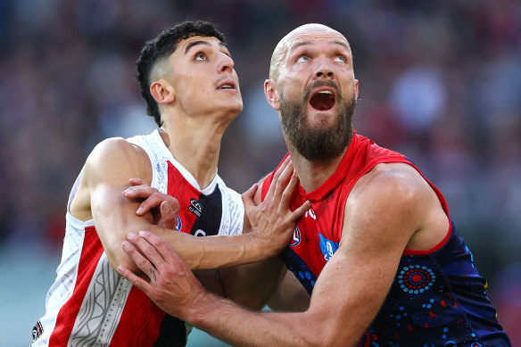 Anthony Caminiti of the Saints and Max Gawn of the Demons compete.