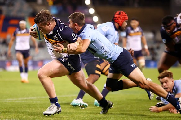 Billy Pollard races to the line to score for the Brumbies