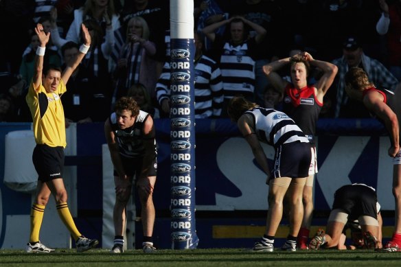 Players look shocked as the siren sounds leaving the result a draw.