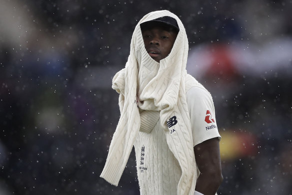 Jofra Archer leaves the ground after play was halted on day one at Old Trafford.
