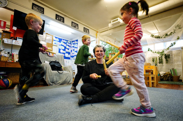 St Paul’s Anglican Kindergarten teacher Rita Earl with Remy Gibson, Christian Nasiakos and Elly Hocking. Earl fears free kinder will make the centre unviable.