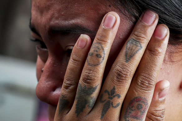 Thae Nu Naing, sister of Saw Pyae, Naing weeps by his body at their home in Mandalay, Myanmar, on Sunday.