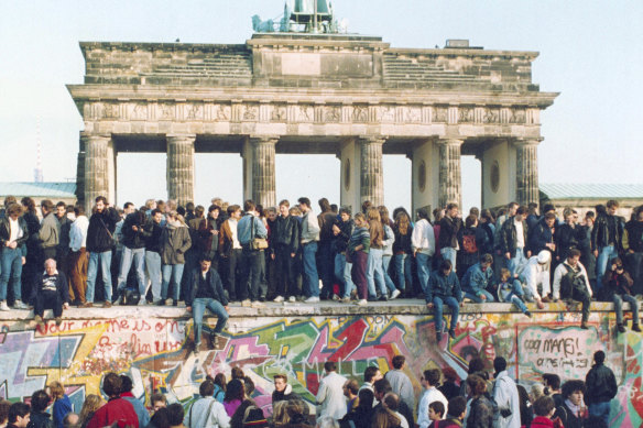Germans from East and West celebrating on the wall the day after the borders opened on November 9, 1989. The fall of the Berlin Wall symbolised the end of the Cold War, an achievement that was largely credited to Mikhail Gorbachev’s leadership.