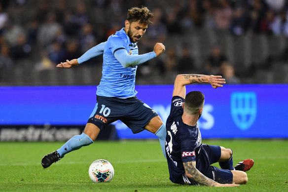 Sydney's Milos Ninkovic scores a goal in the A-League over Melbourne Victory.