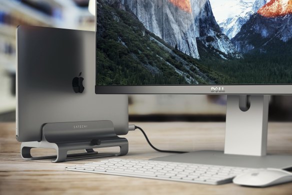 A USB-C adapter and a stand can drastically reduce the amount of desk space your laptop takes up, while also making it easy to tuck cables away.
