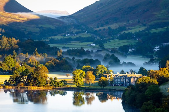 Mist settles at dawn in and around the picturesque English Lake District village of Grasmere.