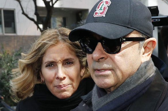 Former Nissan chairman Carlos Ghosn, right, and his wife Carole in Tokyo in 2019.