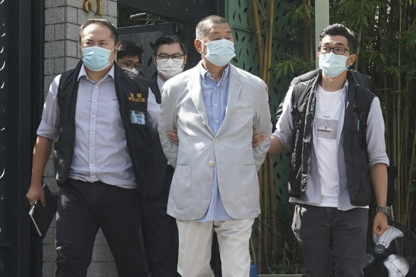 Hong Kong media tycoon Jimmy Lai, centre, after his arrest on Monday.