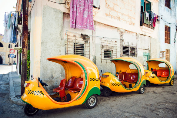 Cuba’s yellow Cocotaxis, designed to resemble a hollowed-out coconut.