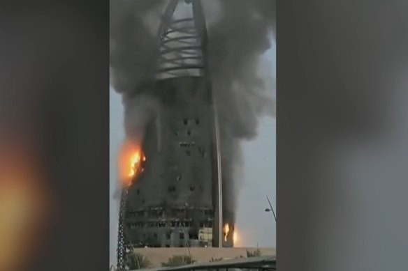 The Greater Nile Petroleum Oil Company Tower in the centre of Khartoum, Sudan, on fire on September 19.