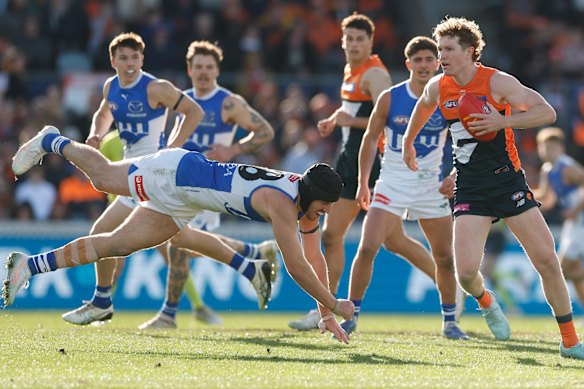 Tristan Xerri from Kangaroos dives after Tom Green, the giants in Canberra.