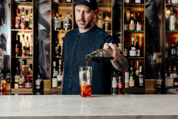 Whiley pouring his Malt Disney cocktail.